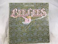 Front cover of Bee Gees Main Course vinyl LP album showing band name and album title with artwork.