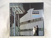 Front cover of Depeche Mode Some Great Reward vinyl LP album showing the industrial building and wedding couple image.