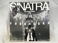 Album cover of Frank Sinatra's 'Sinatra The Main Event Live' showing Sinatra at Madison Square Garden.