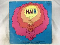 Blue album cover with psychedelic human figure design and Hair soundtrack branding