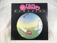 Front view of Heart Magazine album cover with surreal heart and landscape artwork.
