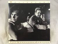 Front cover of the vinyl LP album showing black-and-white photo of John Cougar Mellencamp and an older man sitting at a bar.