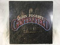 Front cover of vinyl LP album John Fogerty - Centerfield with bold title text and textured background.