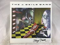 Front cover of The J. Geils Band Freeze Frame album showing surreal artwork and album title.