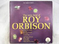 Front cover of 'The Very Best of Roy Orbison' vinyl album showing the title and some featured song titles on a purple background with colored light reflections.