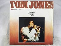 Front cover of the Tom Jones Greatest Hits vinyl record album showing image of Tom Jones singing.