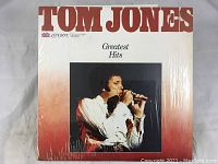 Album cover front showing Tom Jones singing, titled Greatest Hits, London Collection branding visible.