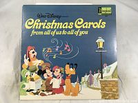 Front cover of the Christmas Carols vinyl LP displaying Disney characters and album title.