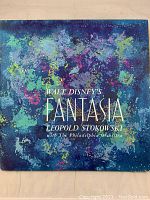 Front cover of the Walt Disney Fantasia vinyl LP set showing colorful artistic design with text.