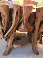 Front view of the carved wood root base