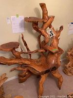 Full view of teak root furniture stand showing branching root base and two platforms