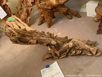 Front view of entire wood carving on display