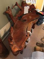 Front view of bench seat and carved root contours