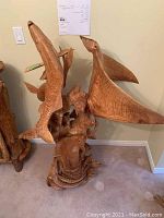 Full front view of the entire sculpture showing manta ray, fish and base