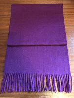 Photo of folded scarf showing rich fuchsia color and smooth texture