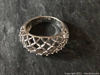 Close-up of the sterling silver ring showing the basket weave pattern and small balls at each intersection.