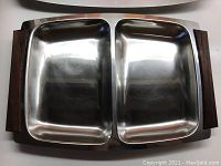 Full top view of the divided two-compartment chrome serving tray with teak handles showing the overall shape and design.