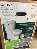 Box front label showing Clean™ tall height round front bowl toilet, 1.28 gpf, 28¼" L x 15¾" W x 30¾" H