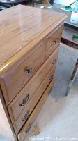 Front view showing the dresser top and drawer fronts with handles and knobs.