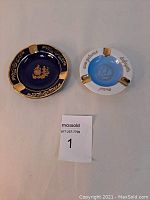 Two ash trays side by side showing top detail.