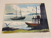 Close-up of painting showing two sailboats anchored near a dock with a seagull flying overhead and signature in lower left