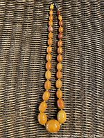 Necklace laid flat to show bead arrangement and color variation