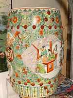 Front three-quarter view showing primary figural and floral panels