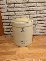 Front view of 3-gallon crock with lid showing '3 Imperial' marking and Medalta Potteries Ltd stamp.