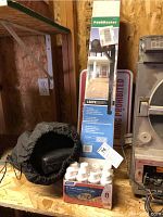 Initial overview of mailbox box, exercise bands pouch, RV toilet treatment pack, and partial sign