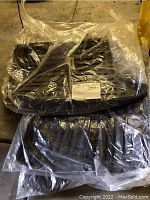 Brown carpet and black plastic floor mats for Dodge Ram still in sealed plastic packaging