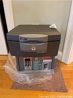 Photo of the two stacked safes showing SentrySafe on top and Honeywell safe below with keypad and branding