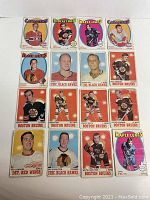 Group photo showing 16 OPC hockey cards from 1970/71 and 1971/72 seasons featuring various NHL players and teams including Bruins, Canadiens, Black Hawks, Maple Leafs and Red Wings.
