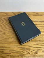 Front cover of the book showing the black textured cover and golden Modern Library logo.