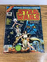 Front cover of the 1977 Marvel Special Edition Star Wars Comic #1 showing main characters Luke Skywalker, Princess Leia, Darth Vader, Chewbacca, R2-D2, and C-3PO with colorful space-themed background and bold Marvel and Star Wars branding.