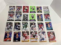 Full layout of 24 hockey cards on a white background showing various NHL players in their team jerseys