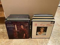 Two stacks of vinyl opera box sets viewed from front, showing cover art and titles including La Forza del Destino and The Merry Widow
