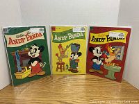 Three Dell Andy Panda comics #17, #18, and #19 in protective sleeves, displayed side by side showing front covers.