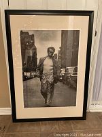 Photo of the framed lithograph of James Dean showing full view of the artwork and frame.