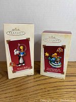 Two Hallmark Keepsake Looney Tunes Christmas ornaments in original boxes, Bubble Bath and Duck Dodgers with Marvin The Martian.