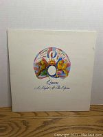 Front cover of 'A Night At The Opera' vinyl showing the colorful crest and title.