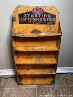 Front view showing CMP logo, 'Starting Lighting Ignition' text, four shelves with visible rust and paint wear.