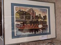 Printed artwork of a swan boat with passengers in Boston Public Garden, in a silver frame.