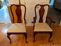 Front view of both chairs: side chair (left) and arm chair (right) on hardwood floor
