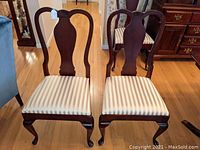 Front view of both chairs showing overall appearance, matching style and condition