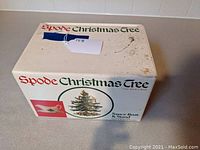 Box featuring Spode Christmas Tree name and image of sauce boat and stand with Christmas Tree pattern, showing some surface stains and wear.