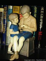 Porcelain figure of two boys titled "The Brothers Tom and Willy" with detailed painting and porcelain finish.