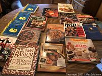 Top view of all cookbooks spread on the table showing colorful covers and titles