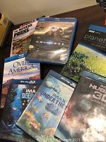 Image showing the tops and covers of a collection of documentary DVDs and Blu-rays focusing on nature, space, and earth.