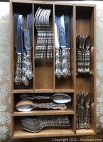 Flatware arranged in bamboo drawer insert showing all pieces.