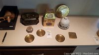 Overall view of lot: boxes, coasters, dish